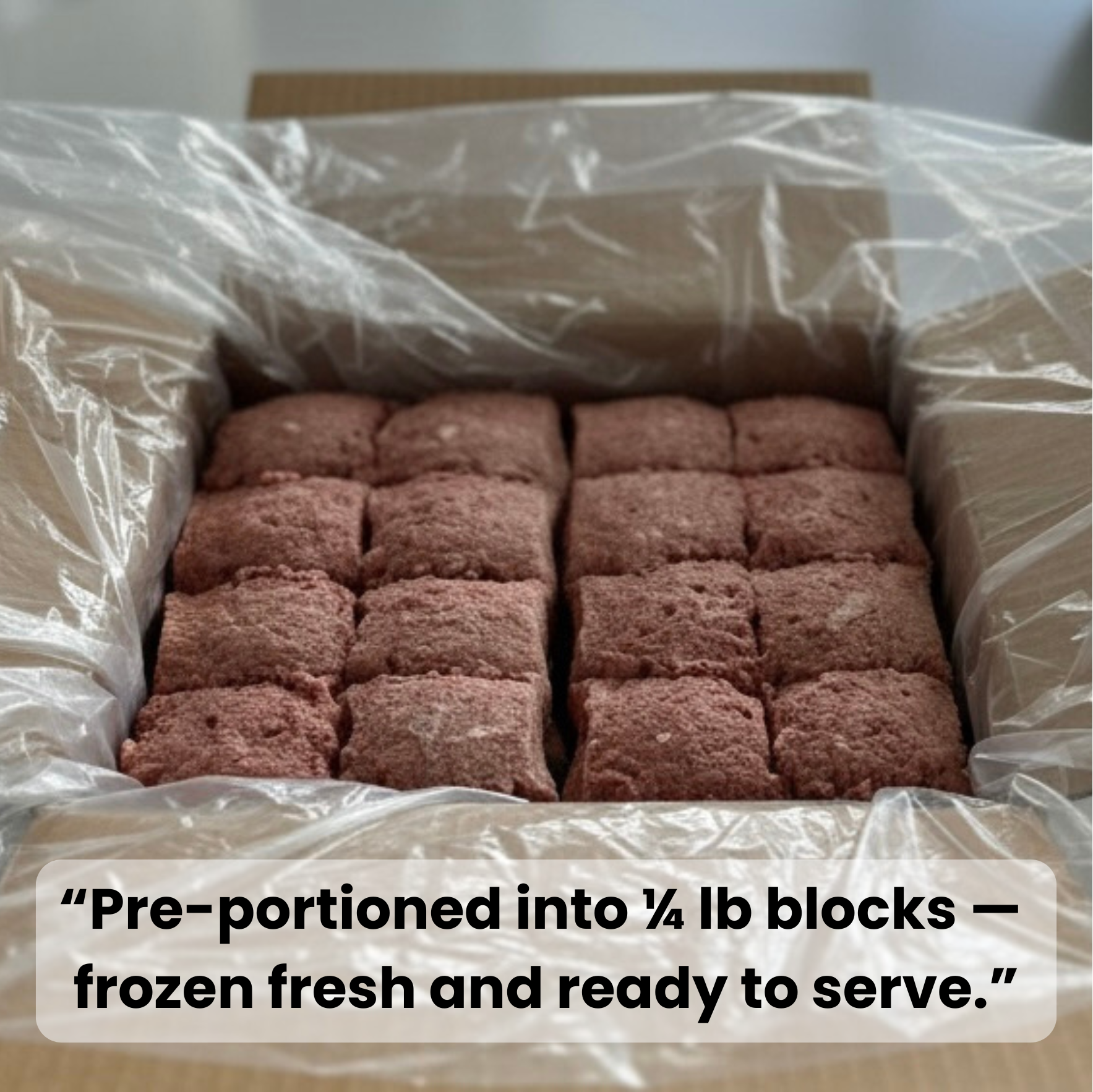 Box of pre-portioned raw meat blocks with clear plastic wrap, text indicating portion size and freshness.